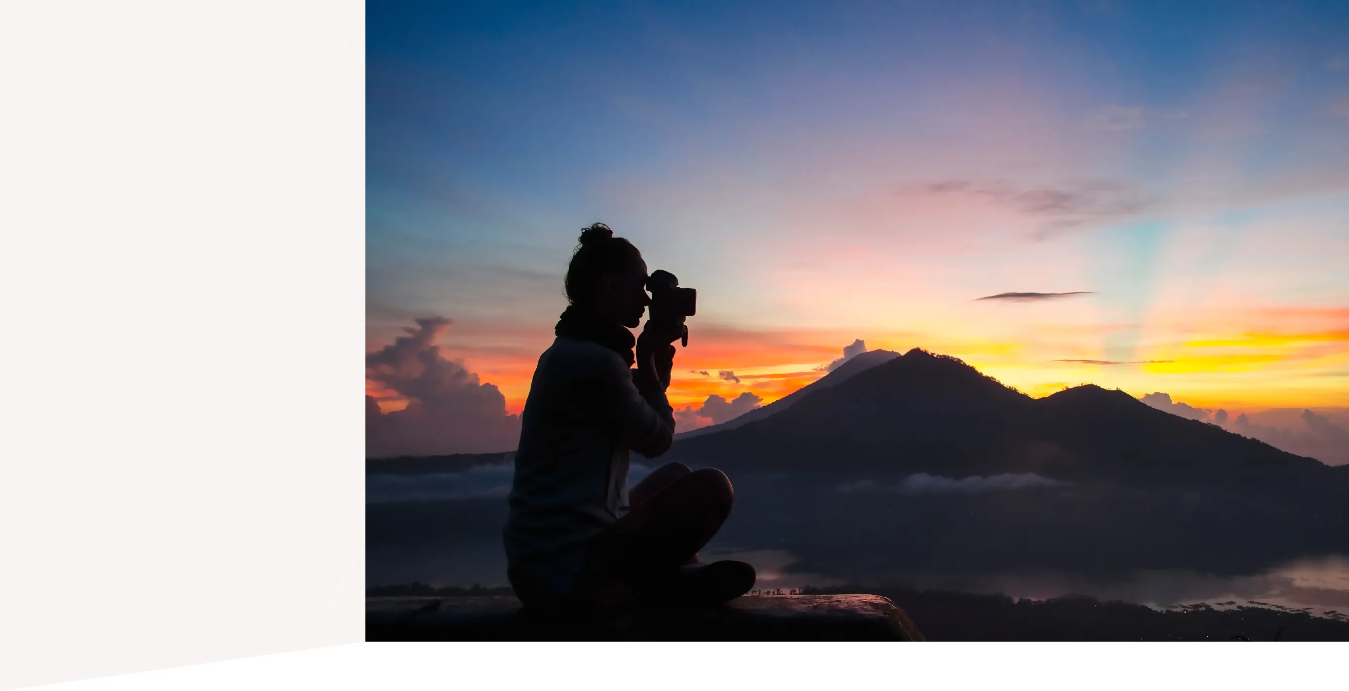 Girl taking photo of sunrise